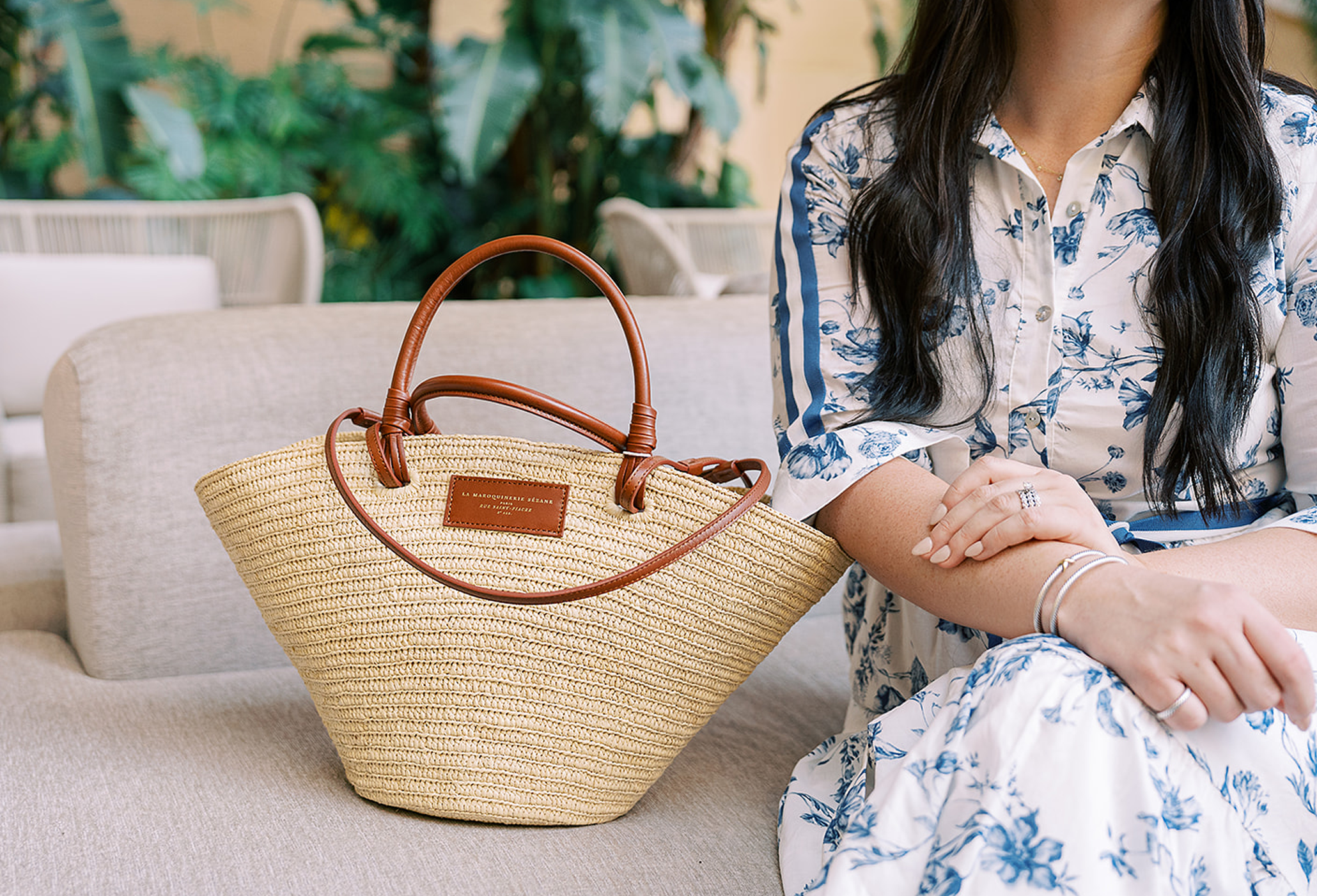 Jordan sitting with her hands on a bag